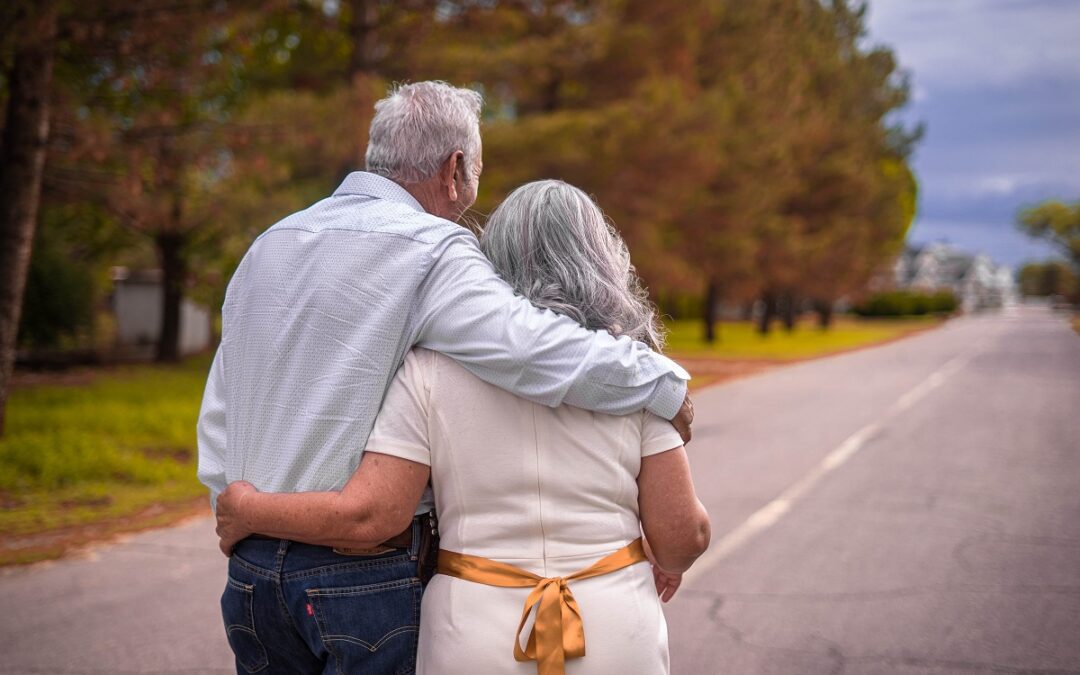 old couple walking on road